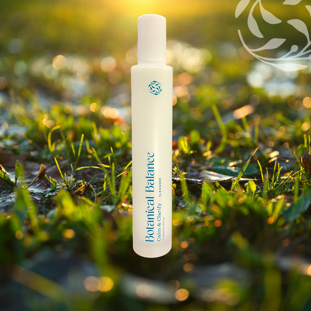 Botanical Balance skincare product bottle on grass with a blurred natural background