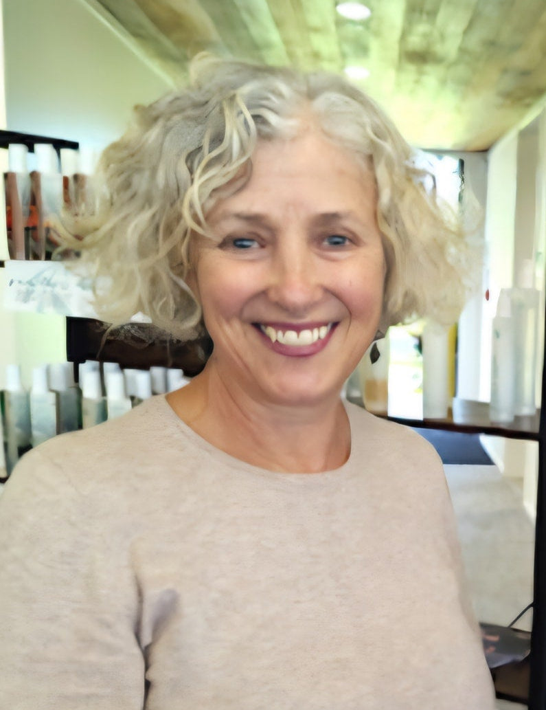 Woman with blonde hair in a salon setting